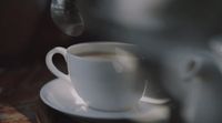 a cup of coffee sitting on top of a saucer