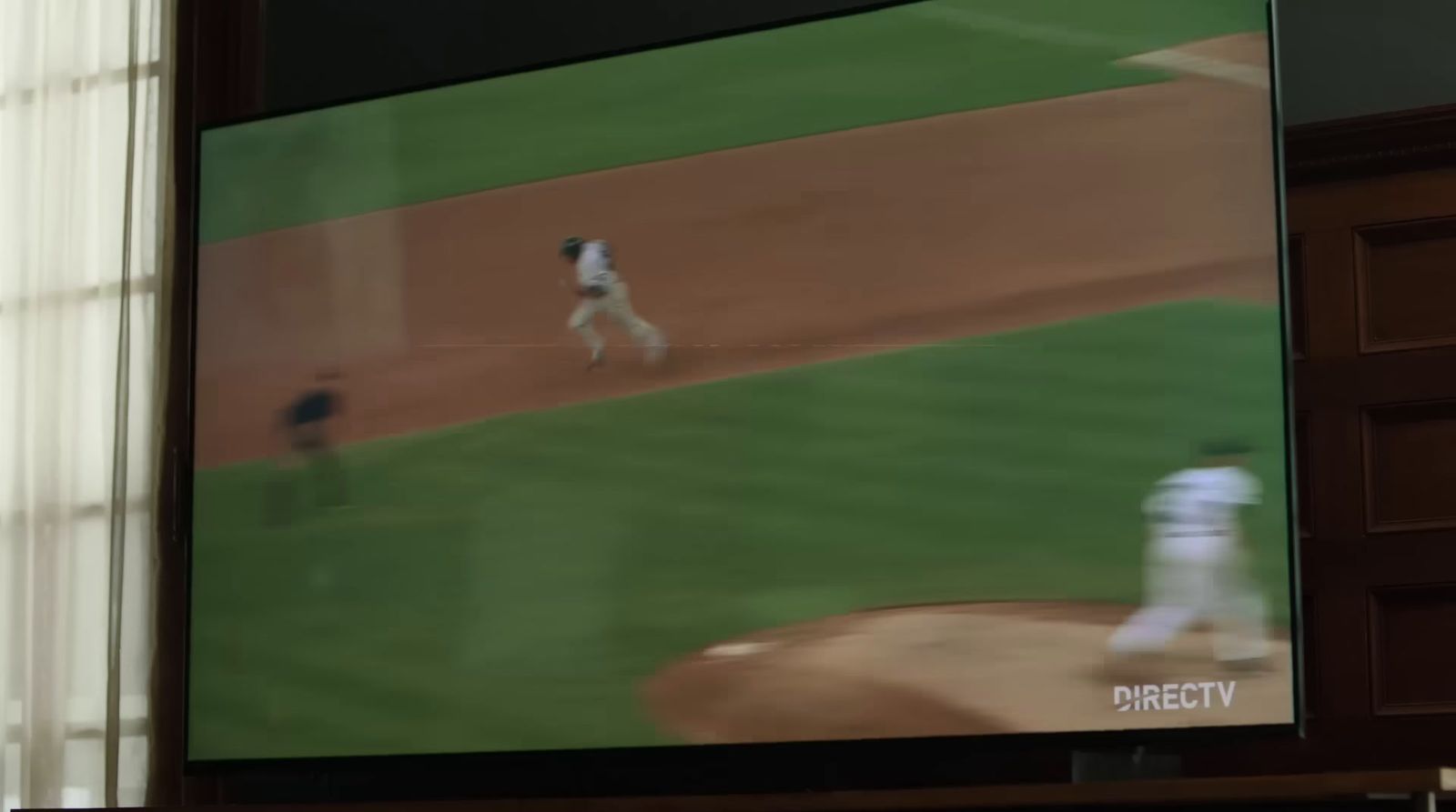 a television screen showing a baseball game being played