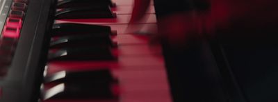 a close up of a red piano keyboard