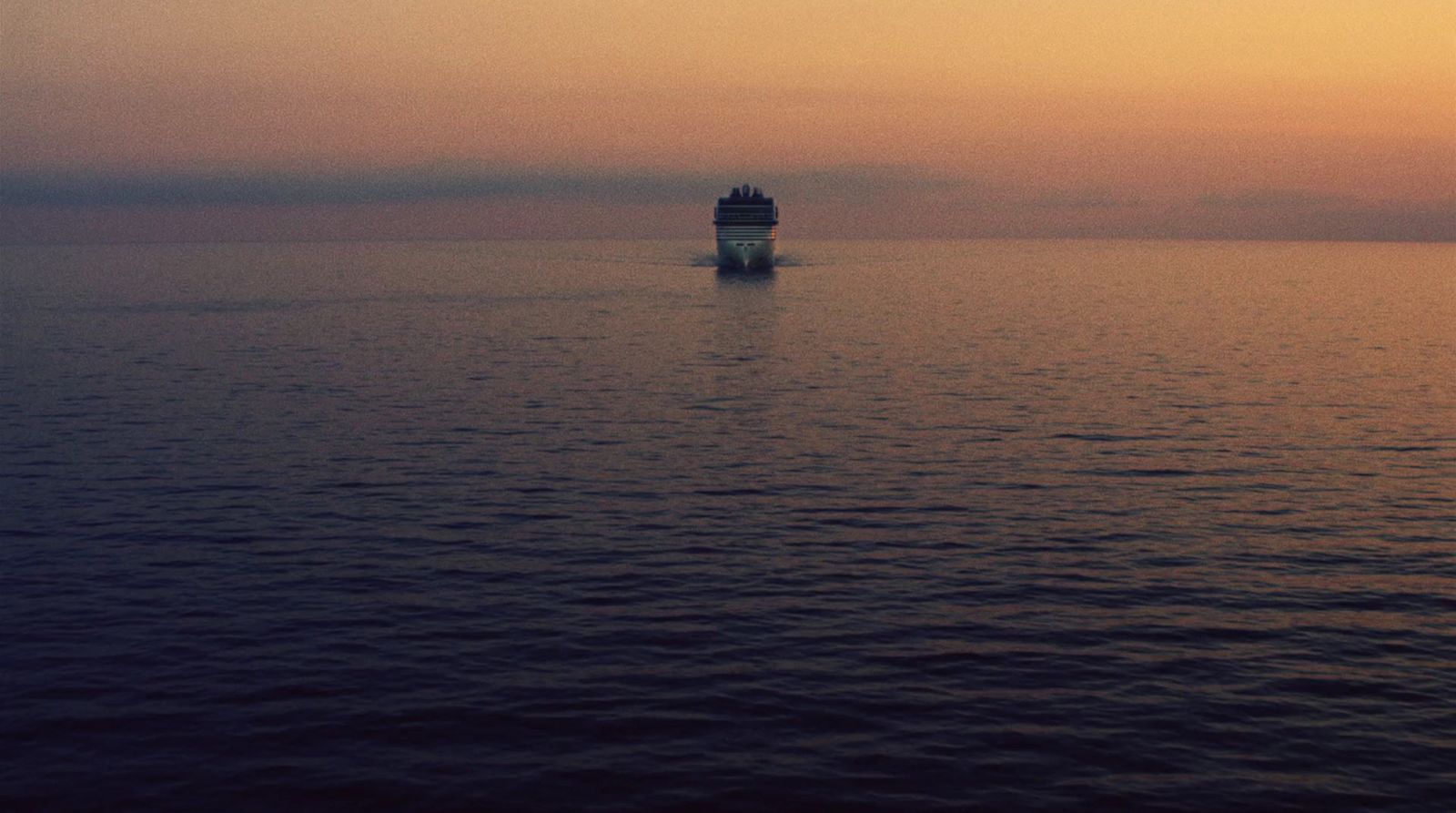 a large boat floating on top of a large body of water