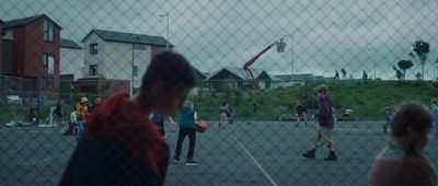 a group of people playing a game of basketball