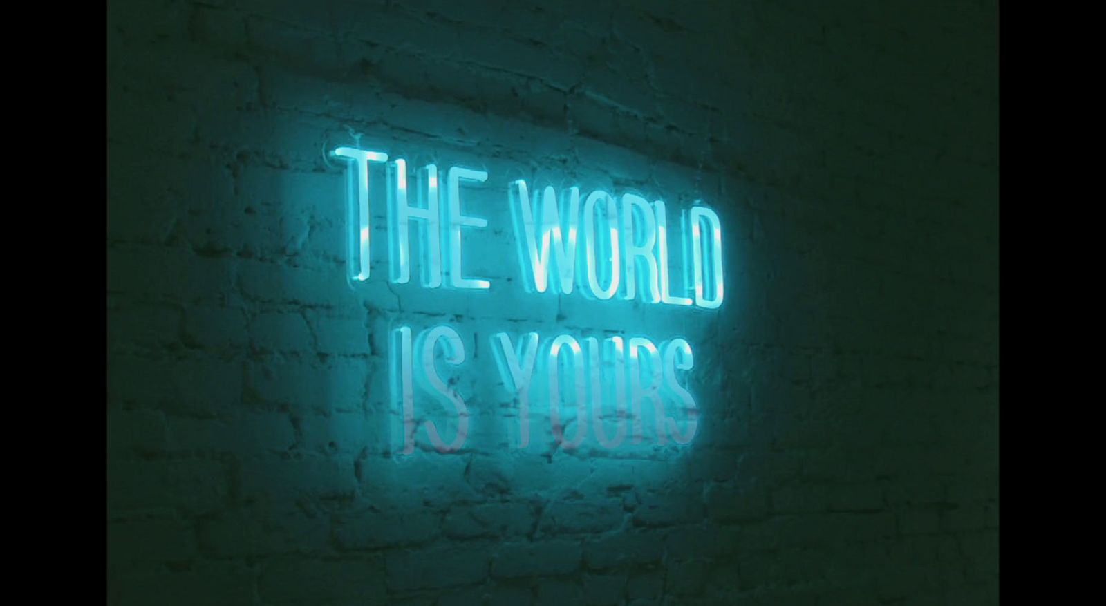 a neon sign that says the world is yours