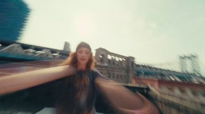 a blurry photo of a woman holding her arms out