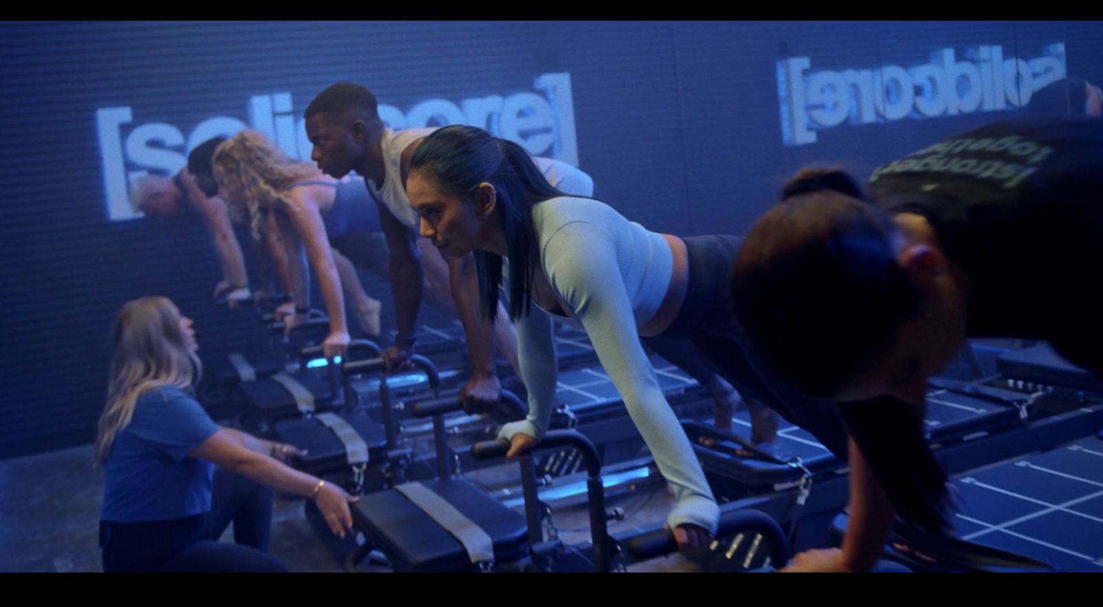 a group of people working out on exercise equipment