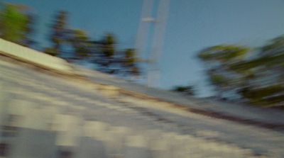 a man riding a skateboard down the side of a ramp