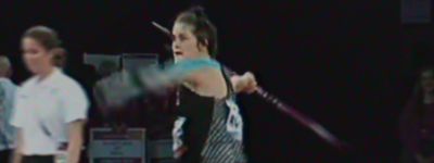 a woman holding a tennis racquet on top of a tennis court