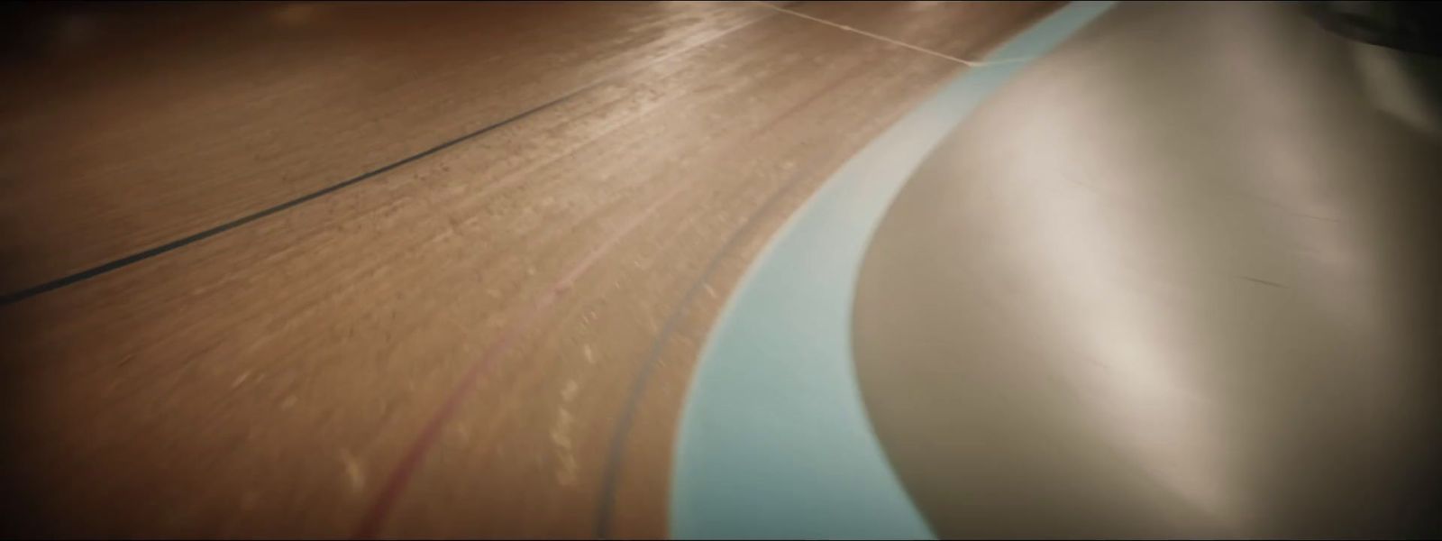 a close up of a skateboard on a wooden surface