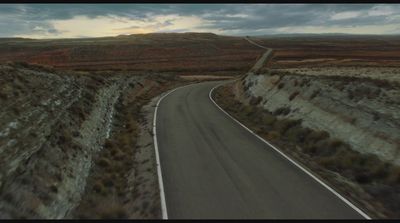 an aerial view of a road in the middle of nowhere