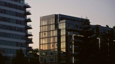 a very tall building sitting next to a tall building