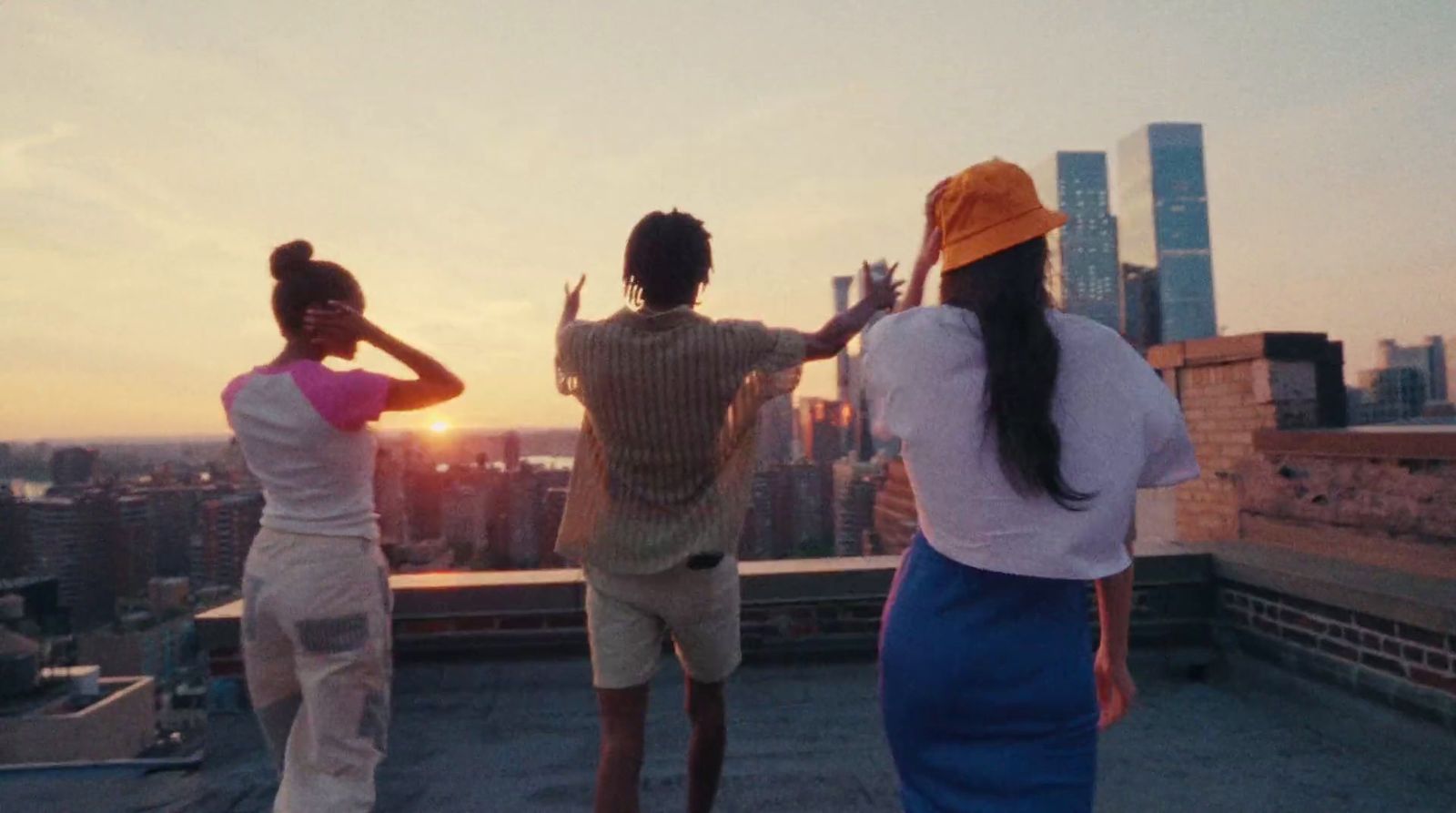 a group of people standing on top of a roof