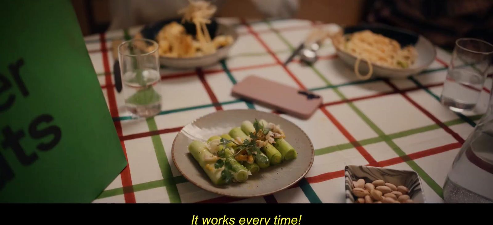 a table topped with plates of food and glasses of water