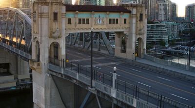 a bridge with a clock tower on top of it