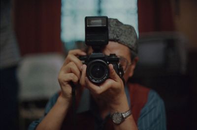 a man taking a picture of himself with a camera