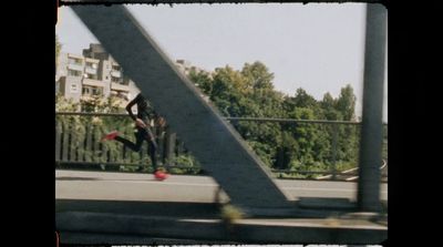 a man riding a skateboard down a metal rail