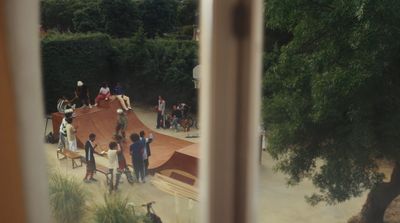 a group of people standing around a wooden ramp