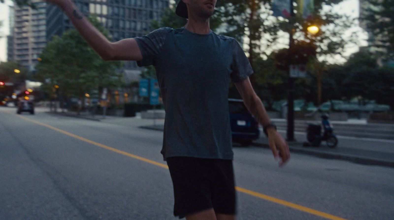 a man riding a skateboard down a street