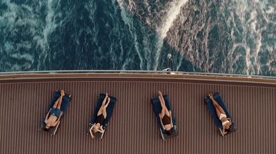 a group of people laying on top of a boat