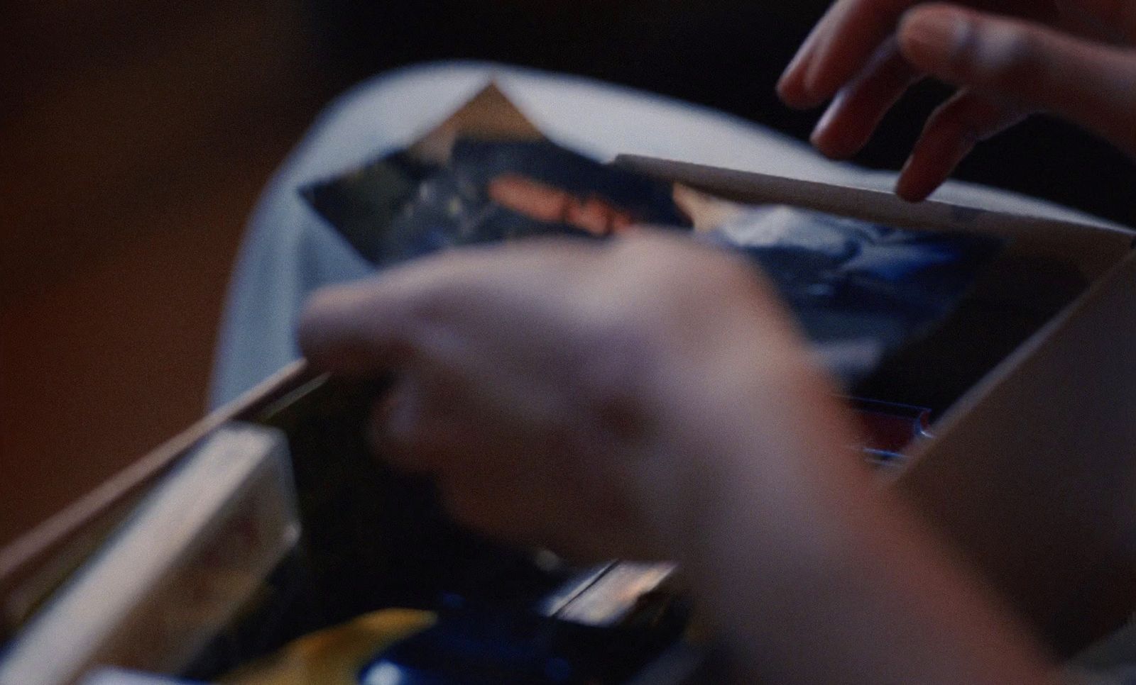 a person's hands holding a tablet computer