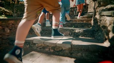 a group of people walking up some steps