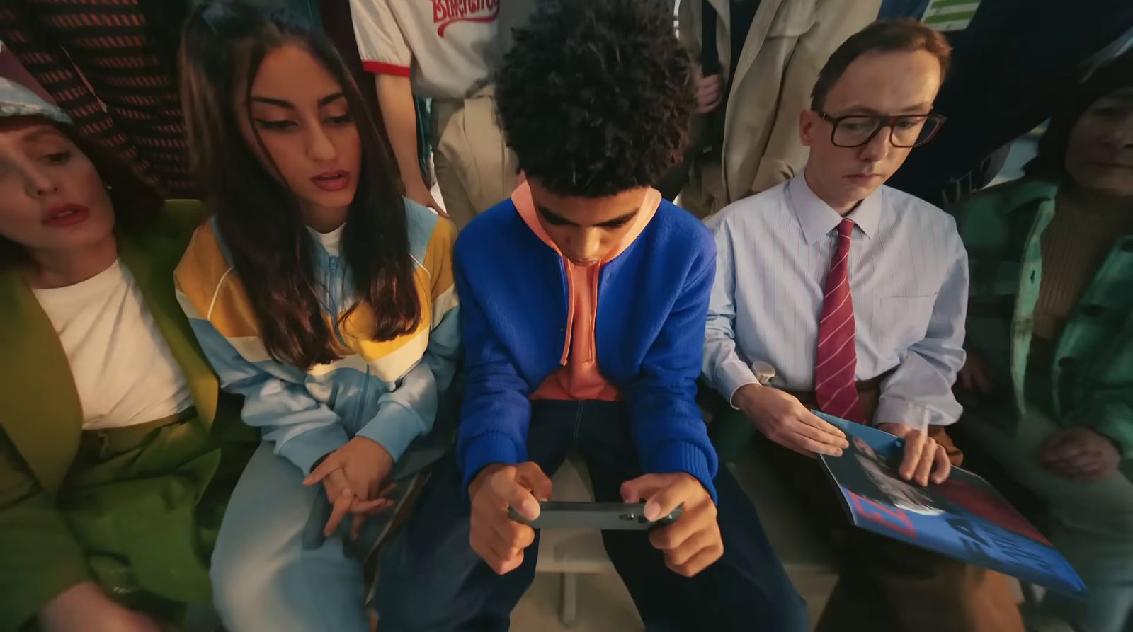 a group of people sitting next to each other