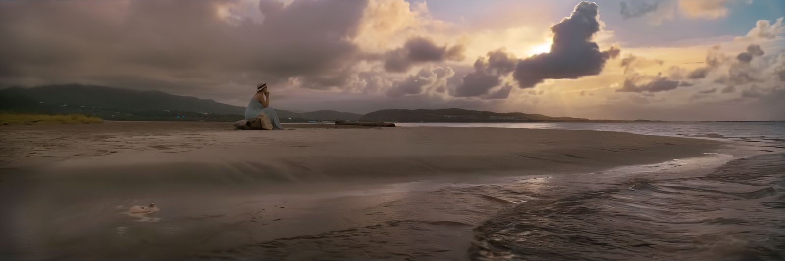 a woman standing on a beach next to the ocean