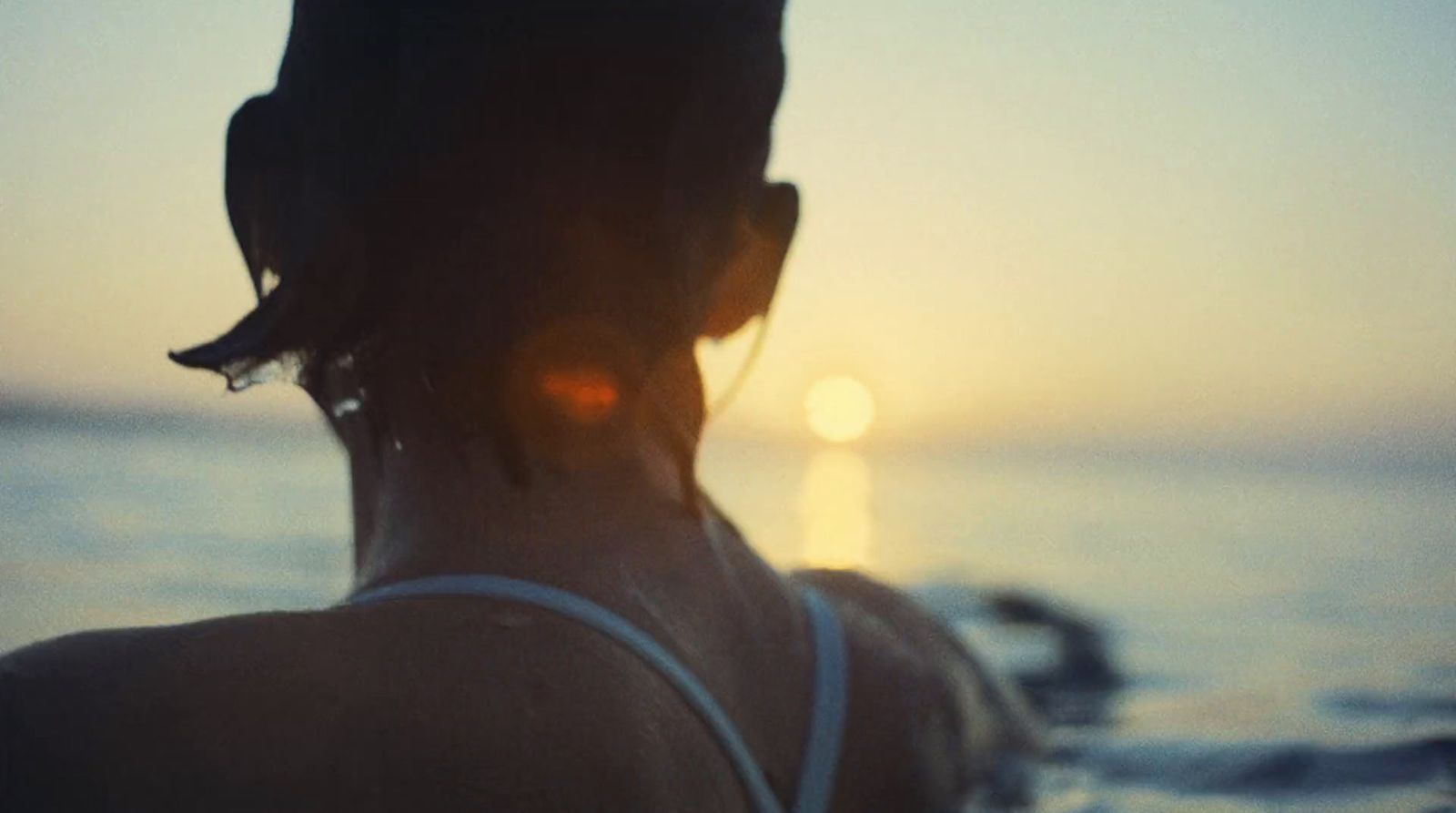 a person standing in front of a body of water