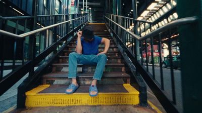 a man sitting on a set of stairs