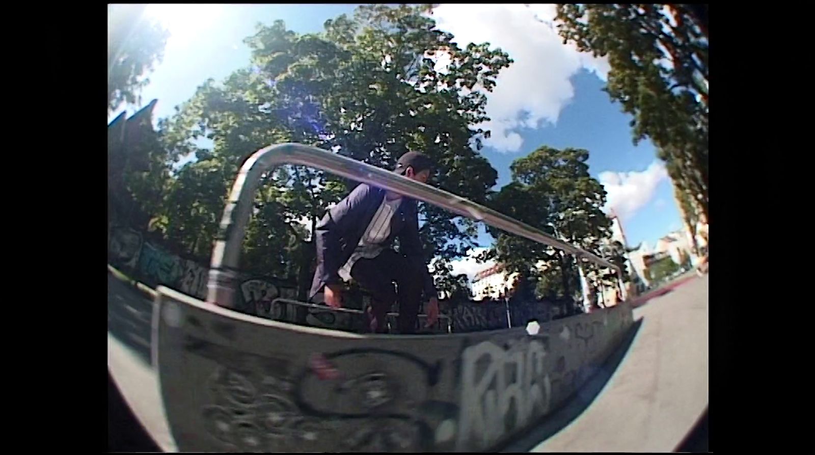 a man riding a skateboard up the side of a ramp