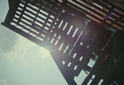 a close up of a metal structure with a sky background