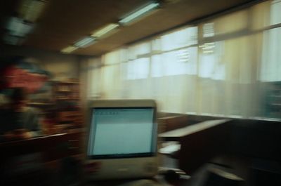 a blurry photo of a computer monitor in a room