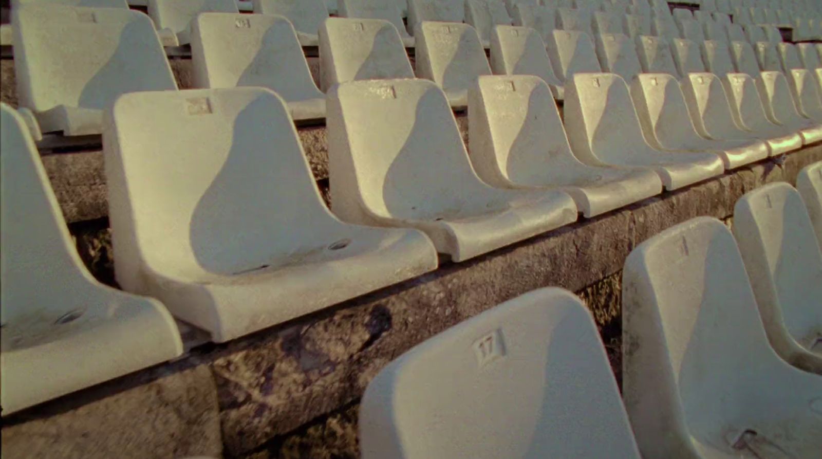 a row of white seats sitting next to each other