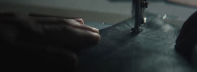 a close up of a person's hand next to a sink