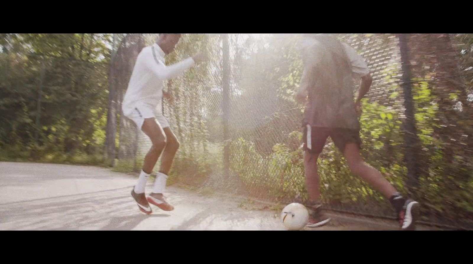 a couple of people that are playing with a soccer ball