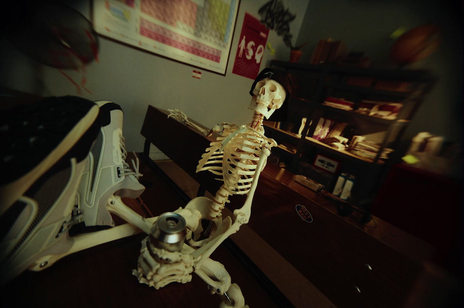 a skeleton sitting on top of a wooden table