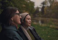 a couple of women sitting next to each other