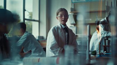 a group of people in lab coats in a room