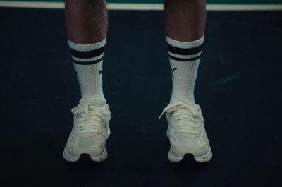 a close up of a tennis player's shoes and socks