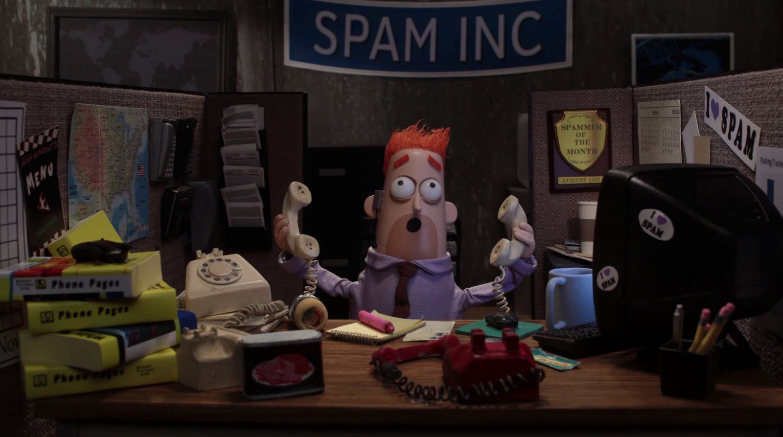 a cartoon character sitting at a desk in front of a computer