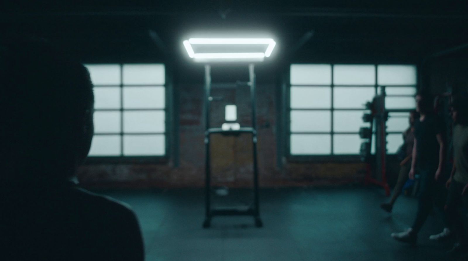 a group of people standing in a dark room