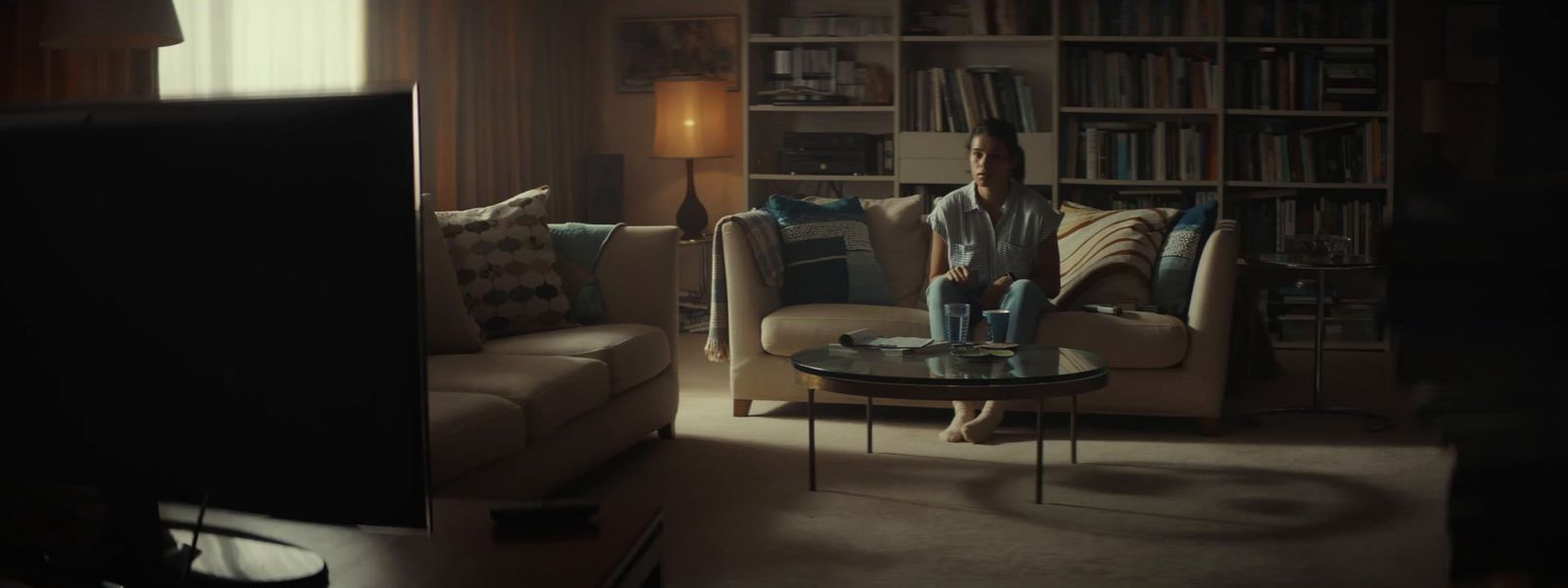 a man sitting on a couch in a living room