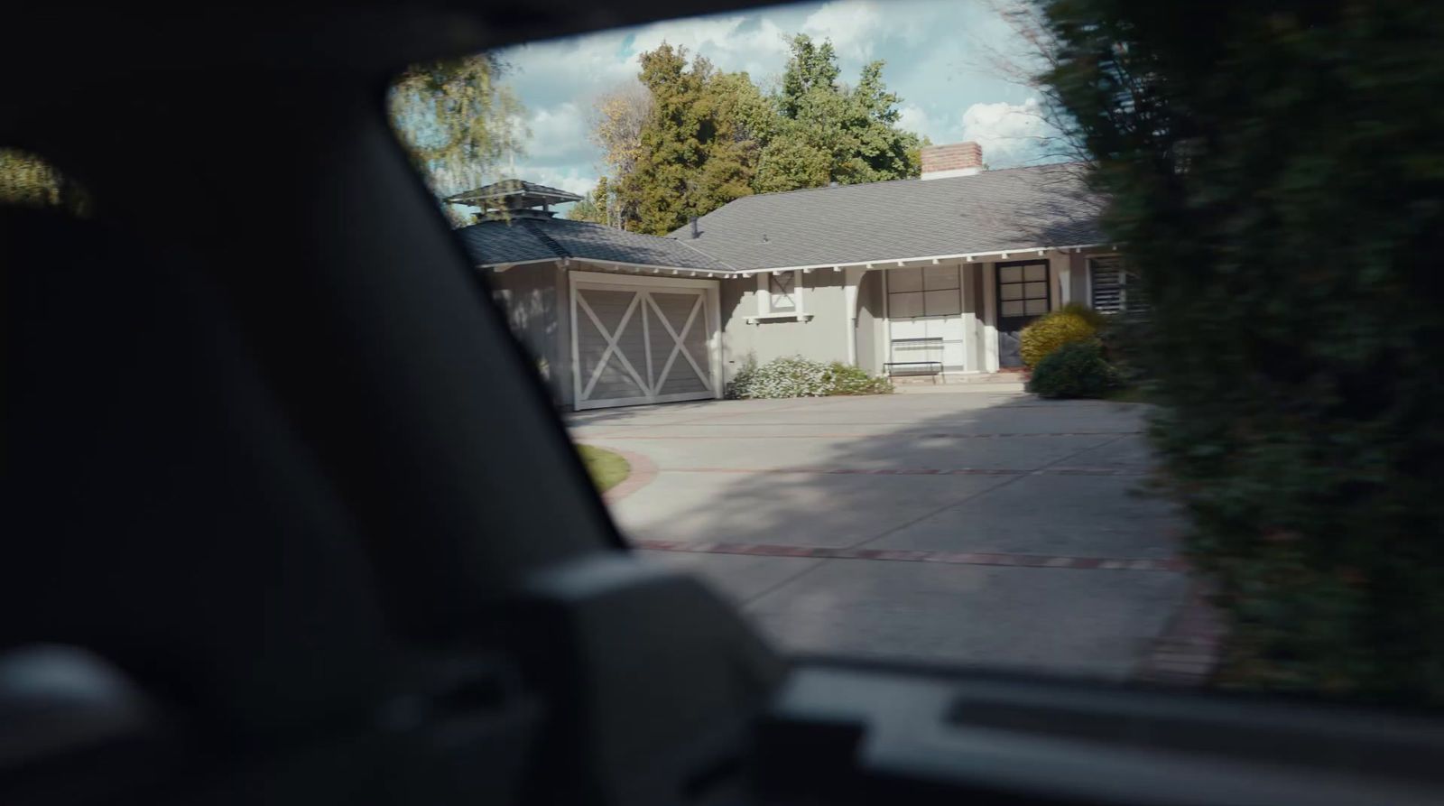 a view of a house from inside a car