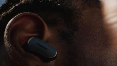 a close up of a man's ear with a cell phone in it