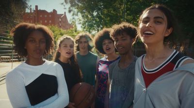 a group of young women standing next to each other