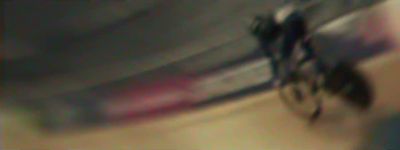 a blurry photo of a person riding a bike