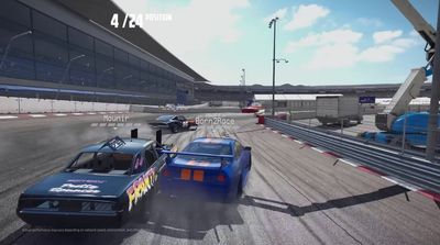 two cars racing on a track in a video game