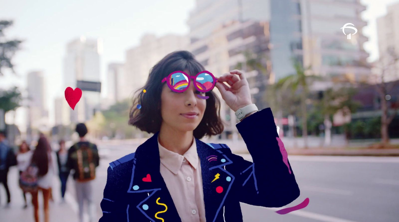 a woman in a suit and sunglasses on a city street