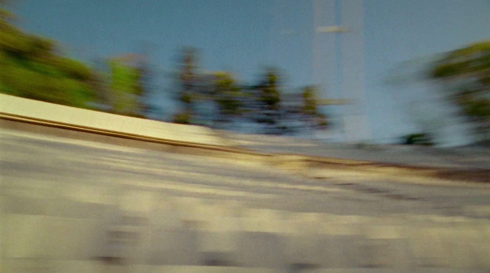 a man riding a skateboard down the side of a ramp