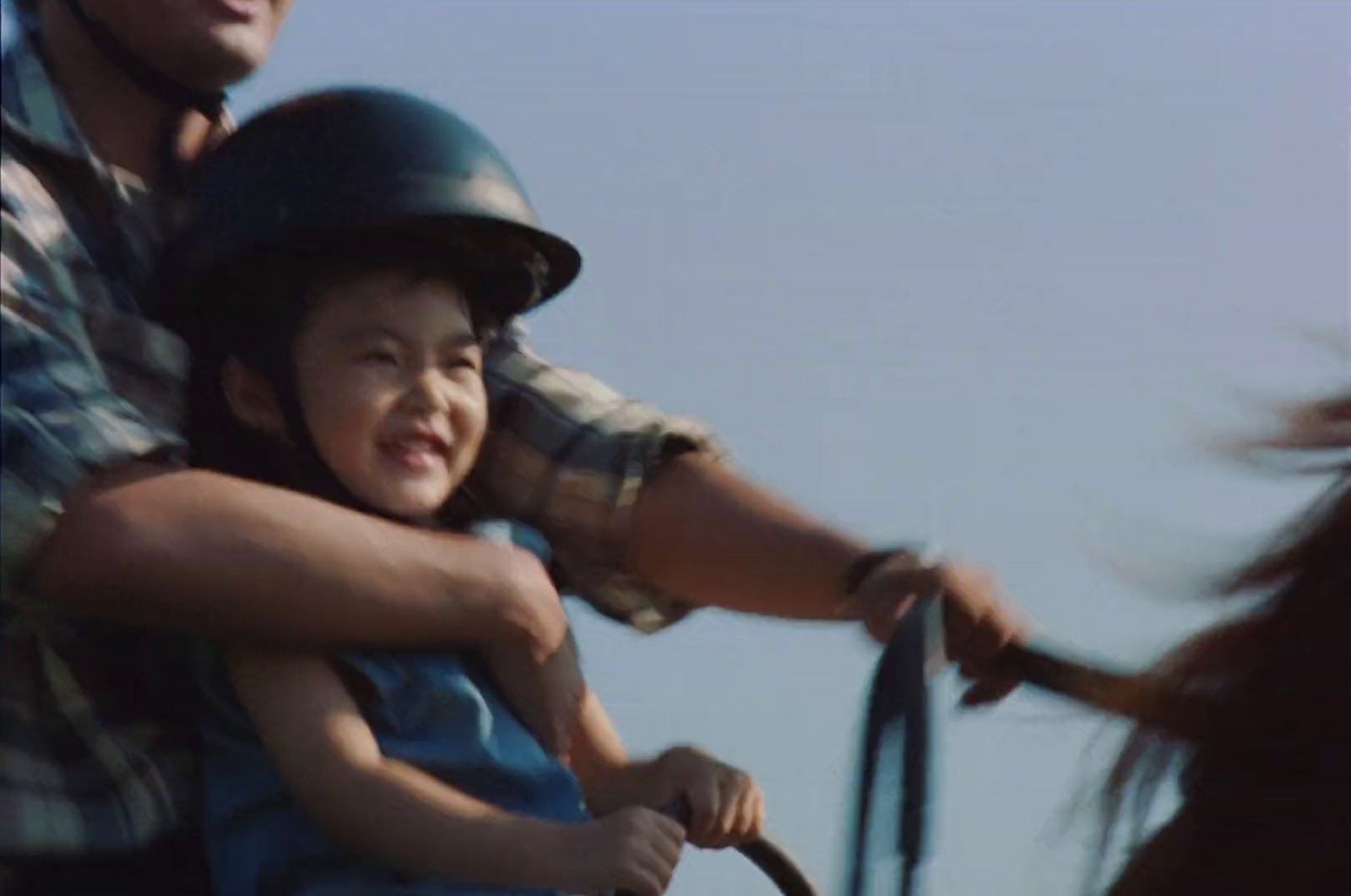 a man riding on the back of a brown horse