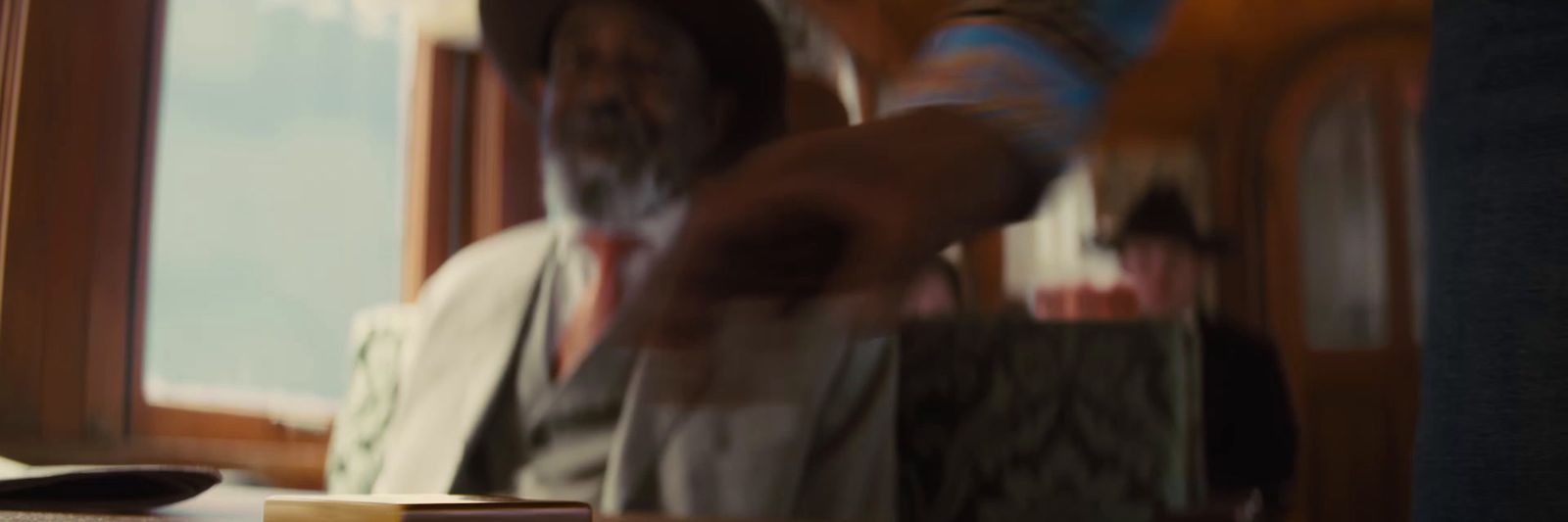 a blurry photo of a man sitting at a table