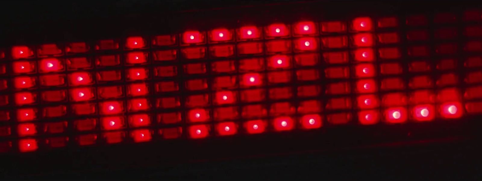 a close up of a red light in the dark